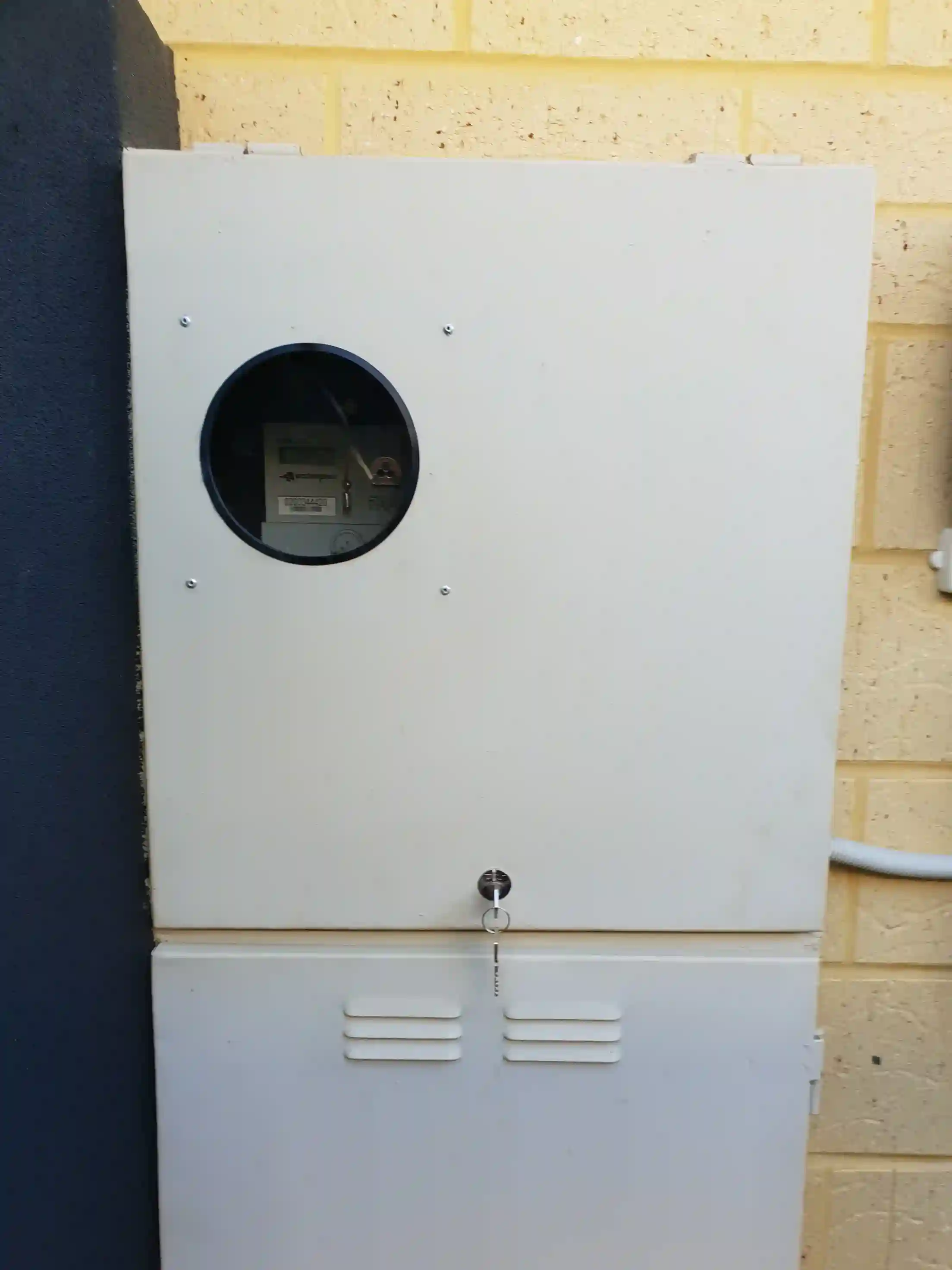 Single meter box with a WAS-approved lock, key and round viewing window installed in Perth
